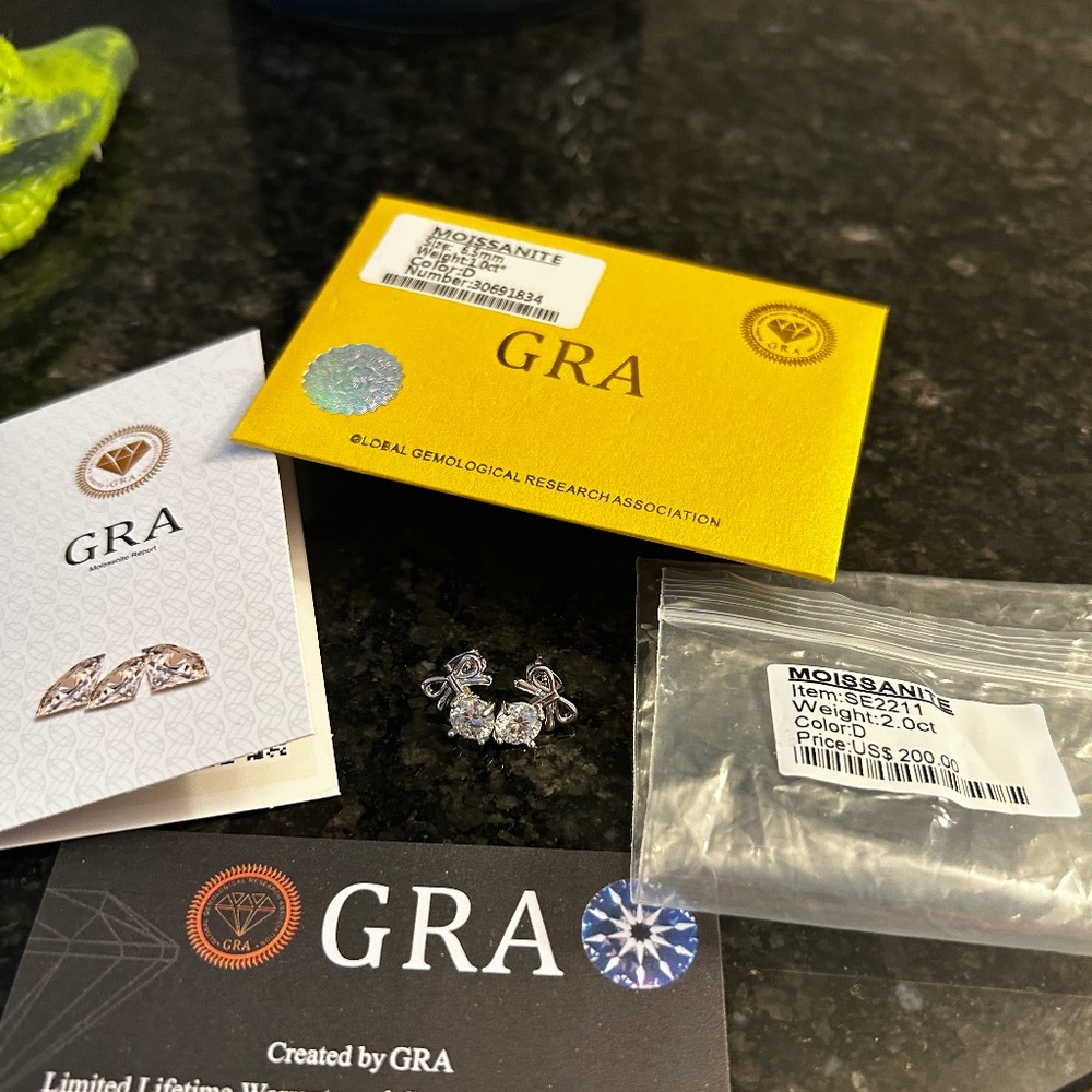 1 cart each pair of Moissanite studs with a bow on top